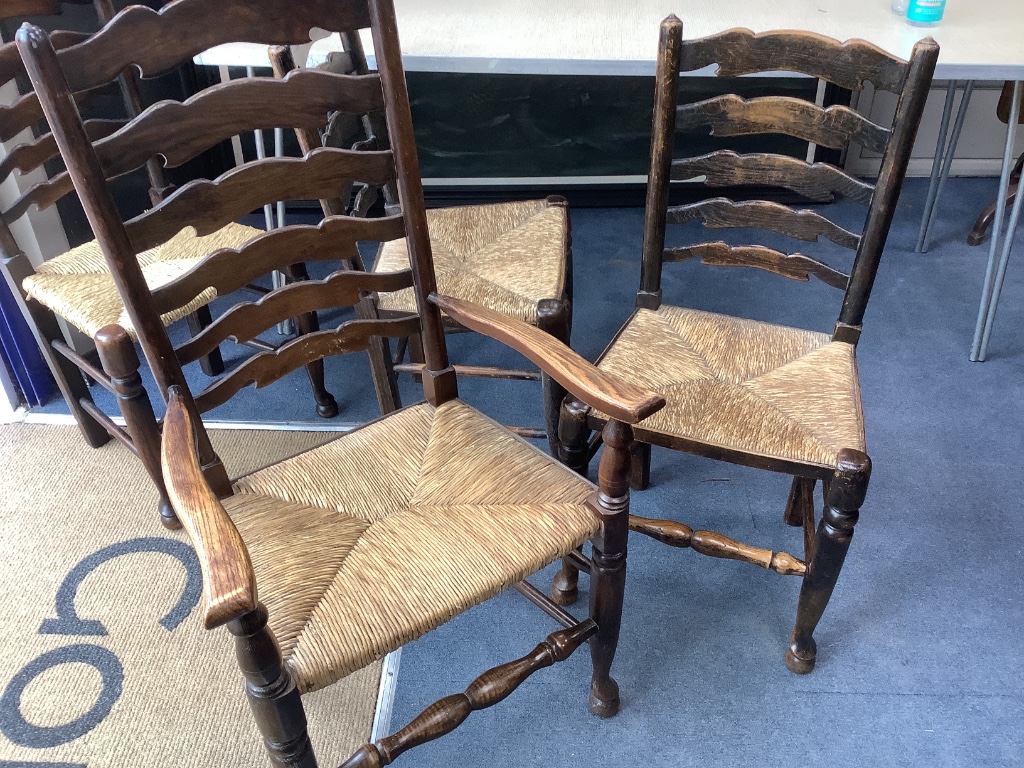 A set of twelve ash rush seat ladder back dining chairs (two with arms)